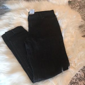 Girl’s black skinny jeans